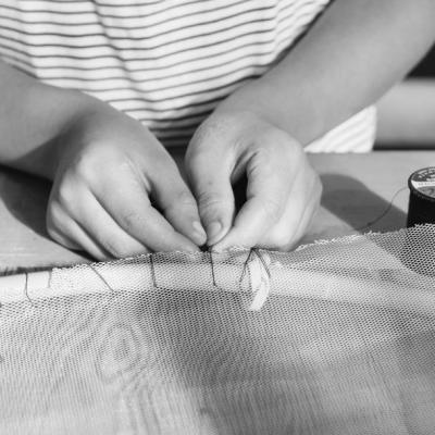 A pair of hands working with a string