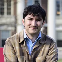 A man smiles at the camera