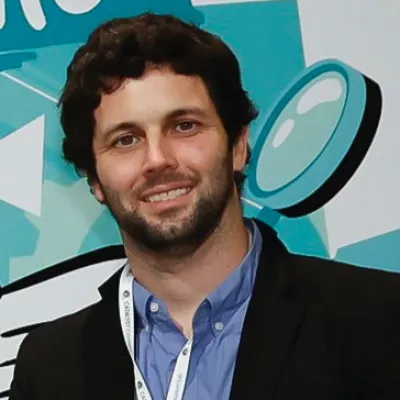 A man smiles at the camera