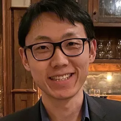 A man smiles at the camera