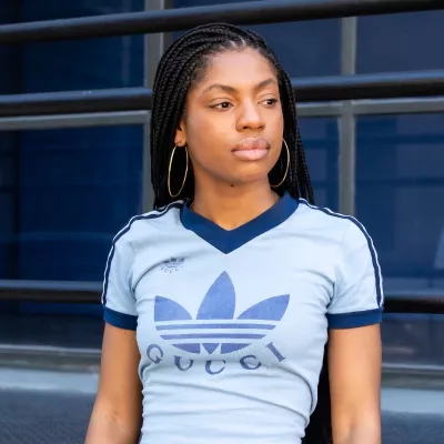 A woman looks away from the camera