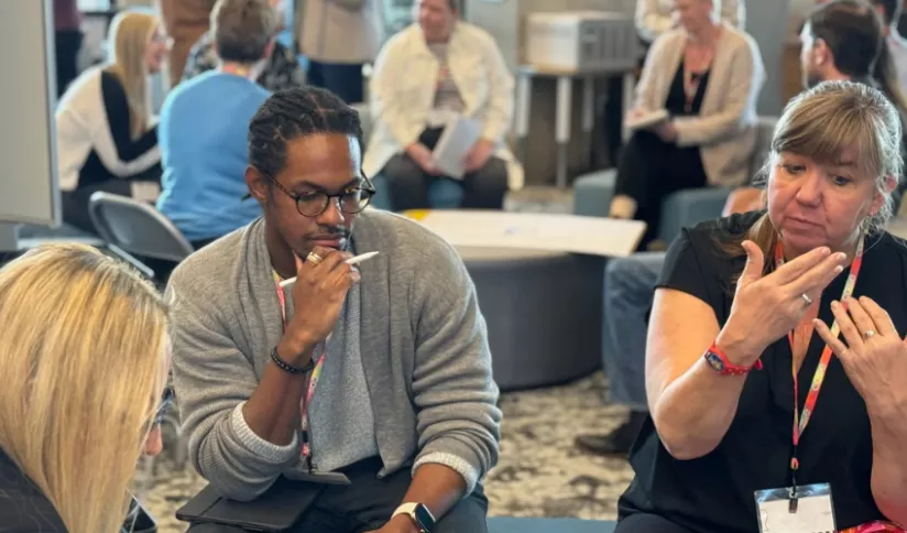 CoT Summit participants engaging in discussion and reflection