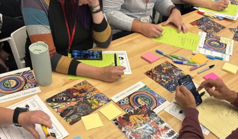 Hands working on workshop project