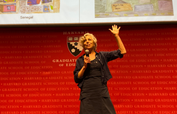 A woman presents on a stage
